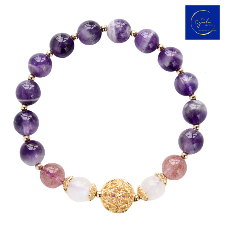 Close-up view of a stunning amethyst bracelet featuring polished purple amethyst beads and a gold-tone decorative bead centerpiece. The bracelet showcases its spiritual and healing properties, perfect for enhancing personal well-being and energy. Available at Oyracha Jewelry.