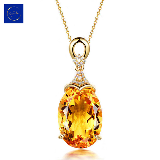 Close-up view of a luxurious citrine pendant necklace from Oyracha Jewelry. The oval-cut citrine gemstone is beautifully set in a gold frame, enhanced with a delicate diamond-studded bail, making it a perfect statement piece for any occasion.