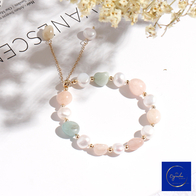 Top angled view of a pastel moonstone and freshwater pearl bracelet by Oyracha Jewelry, featuring soft pink, green, and peach moonstone beads paired with delicate pearls and gold accents. The bracelet is displayed on a minimal white background, enhancing its elegant and gentle design.