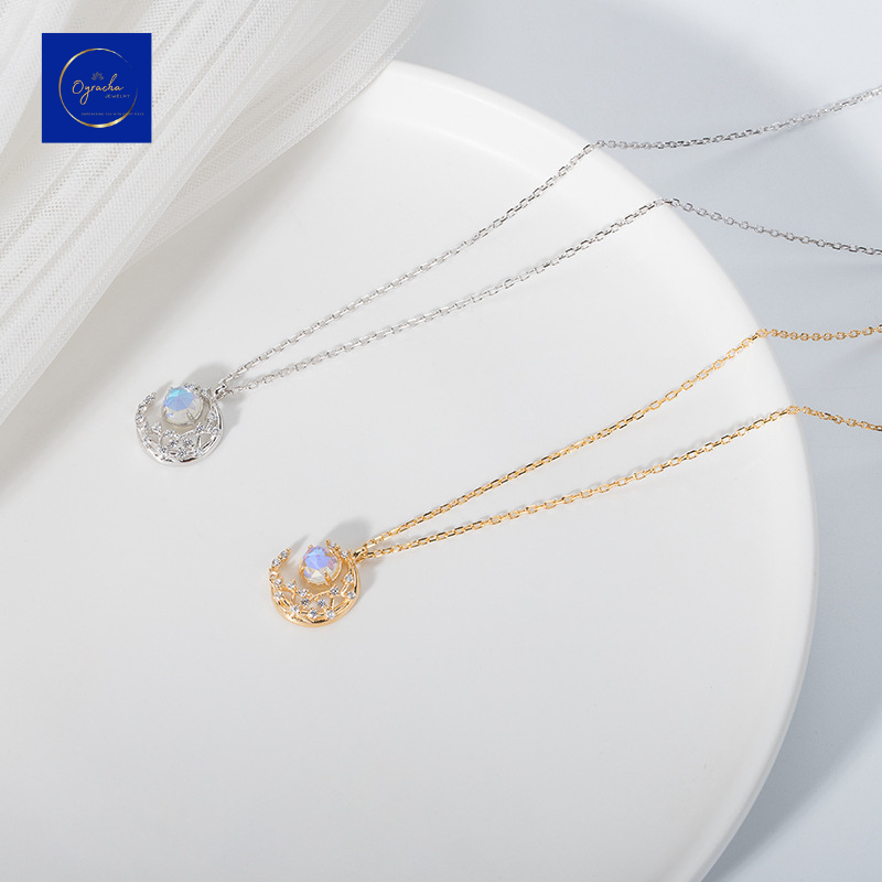 "Elegant silver and gold moonstone necklaces, displayed in a top-down angle view, by Oyracha Jewelry. Featuring a luminous moonstone in an intricate crescent design, these necklaces are perfect for those seeking balance and harmony. Discover Oyracha's zodiac-inspired gemstone collection."
