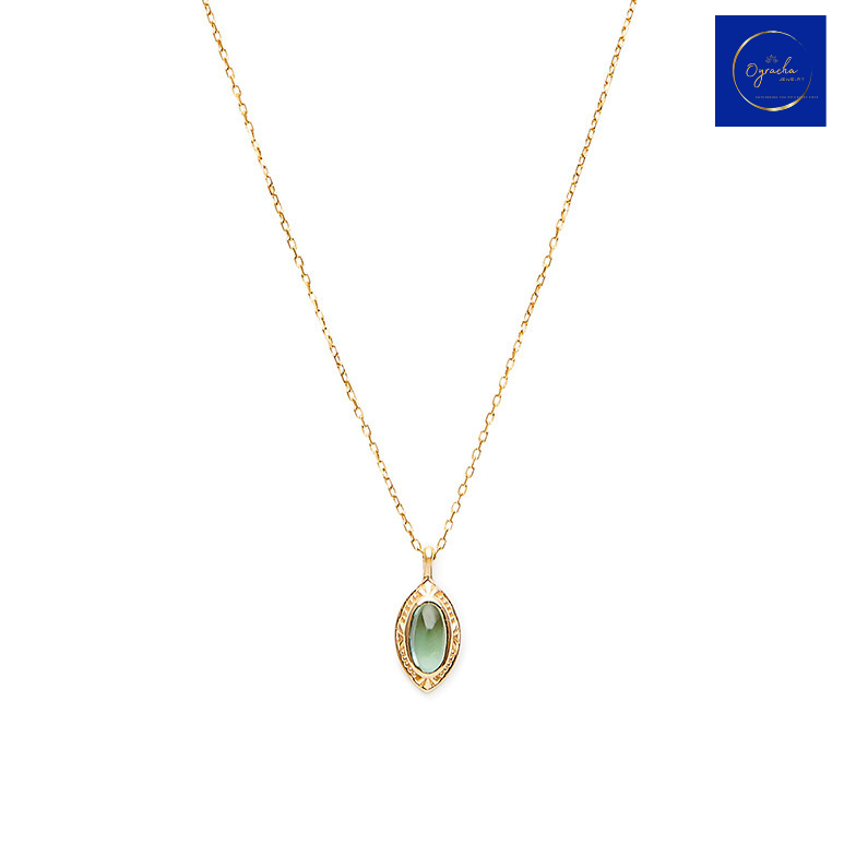 "Minimalist peridot gemstone necklace with gold chain by Oyracha Jewelry. Featuring a delicate natural peridot pendant, this piece symbolizes protection and prosperity, ideal for individuals born under the Chinese zodiac sign Monkey. Explore Oyracha's zodiac-inspired jewelry collection."