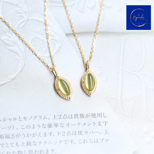 "Elegant peridot gemstone necklaces with gold detailing from Oyracha Jewelry. These unique necklaces feature a natural peridot, symbolizing healing and prosperity, perfect for individuals born under the Chinese zodiac Monkey. Shop Oyracha's zodiac-inspired jewelry collection."