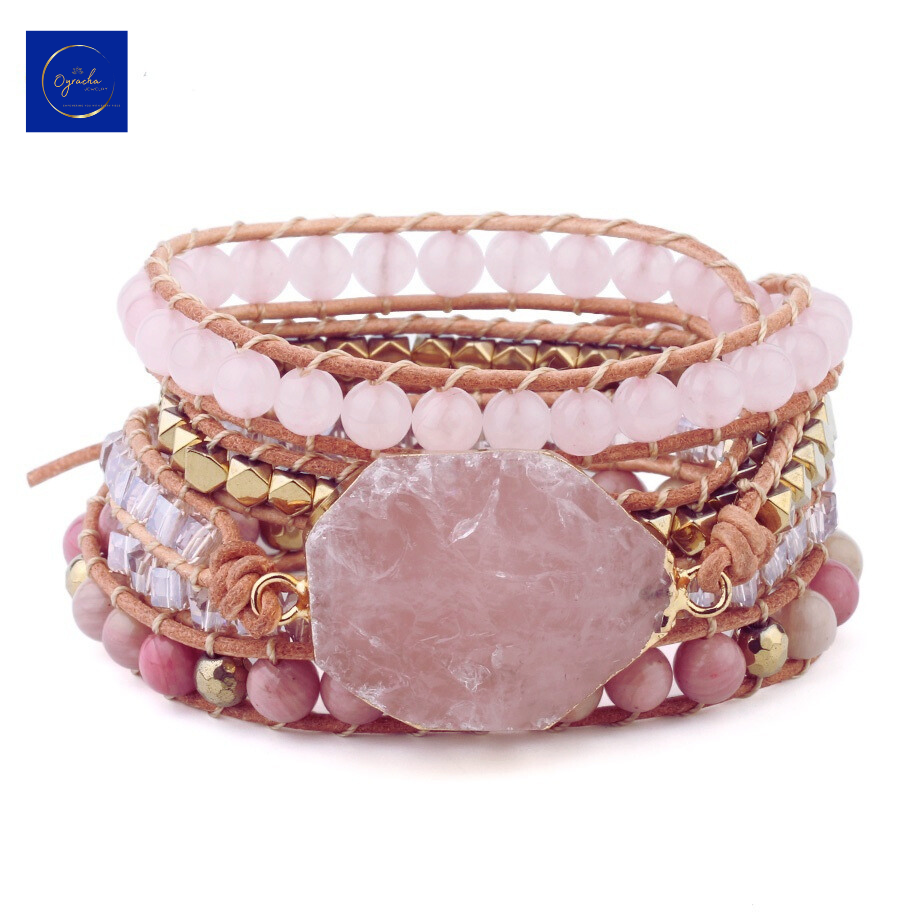 "Chic rose quartz wrap bracelet featuring natural stone beads and gold accents, captured from a front angle view, by Oyracha Jewelry. This handcrafted piece symbolizes love and healing, making it a perfect addition to any zodiac-inspired collection. Explore Oyracha's gemstone and spiritual jewelry line."