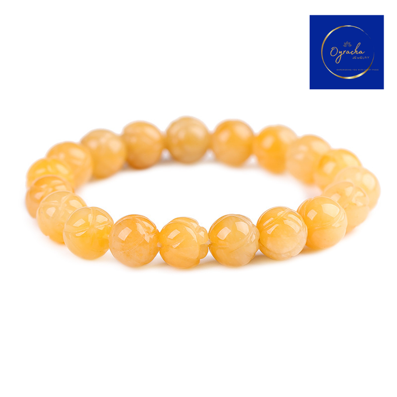 "Polished golden topaz gemstone bracelet, captured from a front angle view, by Oyracha Jewelry. This elegant bracelet features round topaz beads, symbolizing prosperity and positive energy, ideal for individuals born under the Chinese zodiac sign Horse. Explore Oyracha's gemstone and zodiac jewelry collection."