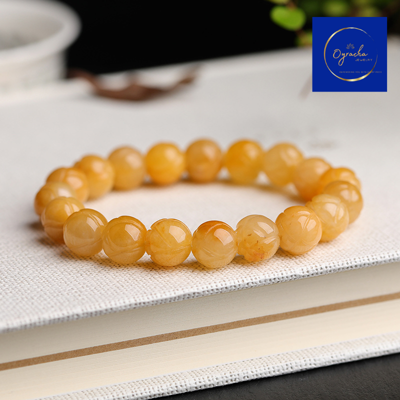 "Golden topaz gemstone bracelet, captured from a side angle view, by Oyracha Jewelry. The round, polished topaz beads symbolize prosperity and positive energy, making this bracelet ideal for individuals born under the Chinese zodiac sign Horse. Explore Oyracha's zodiac and gemstone jewelry collection."